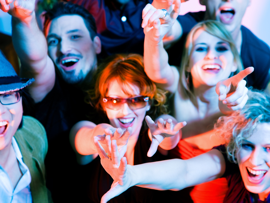 Crowd cheering - their rock idol or simply having fun in a club (Focus on hands!)
