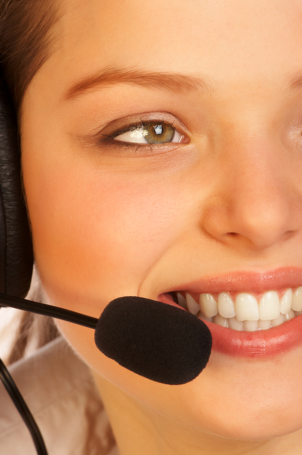 smiling attractive woman with a headset.